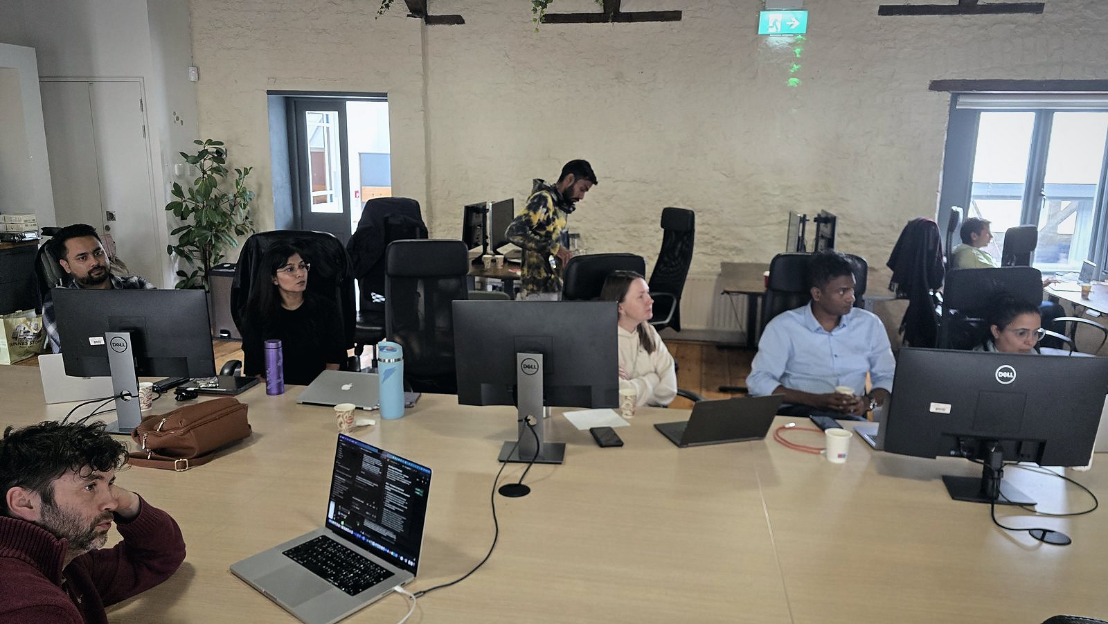 A team presenting while the room listens