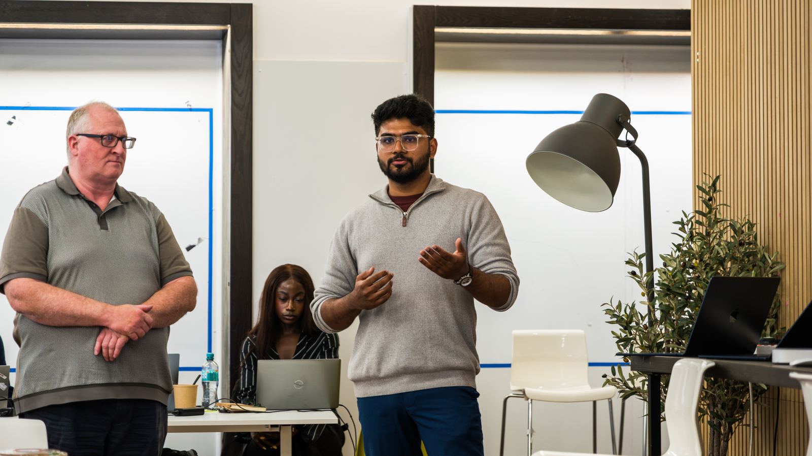 A team standing up to give its recommendation