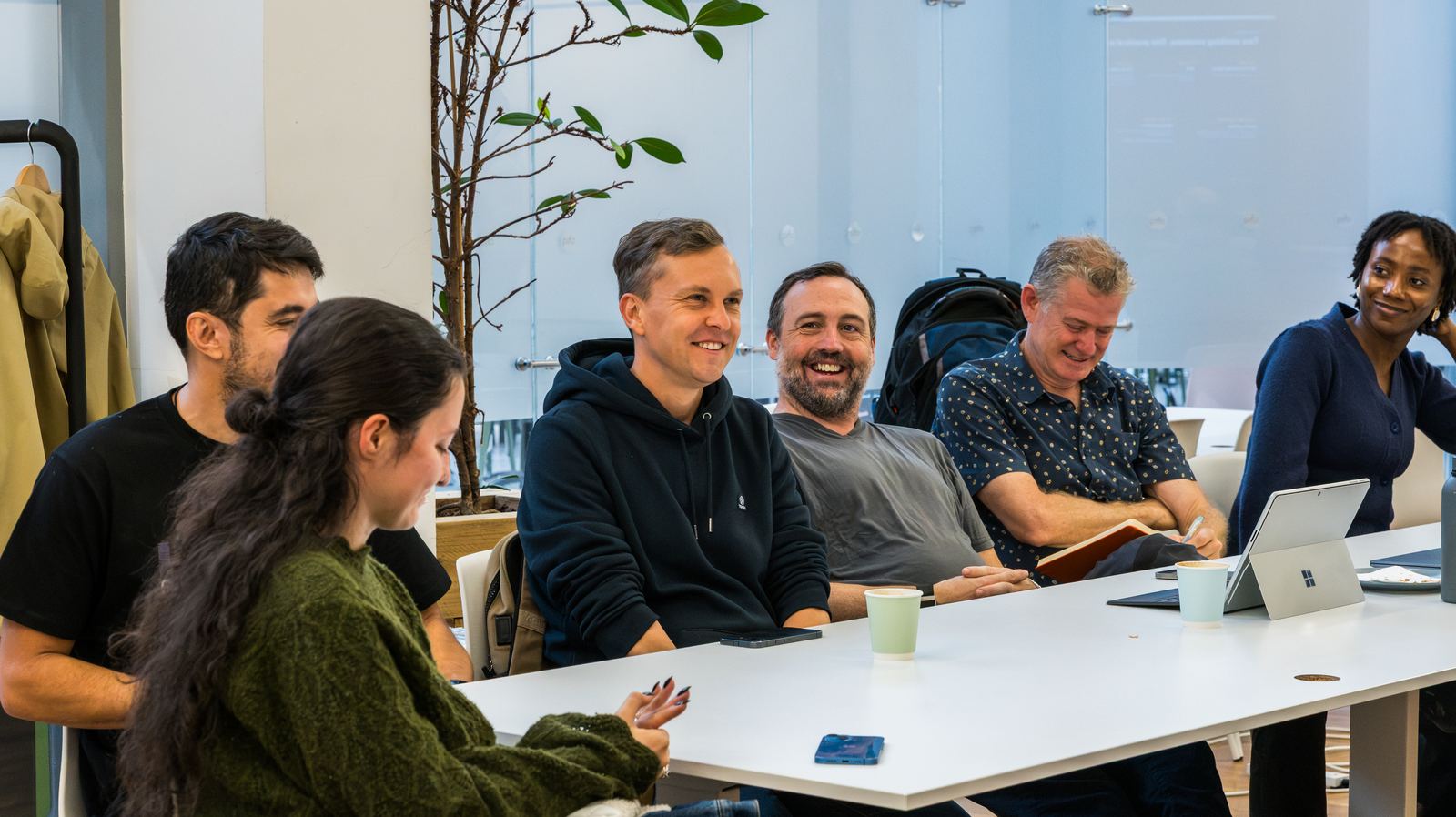 A team listening to a founder